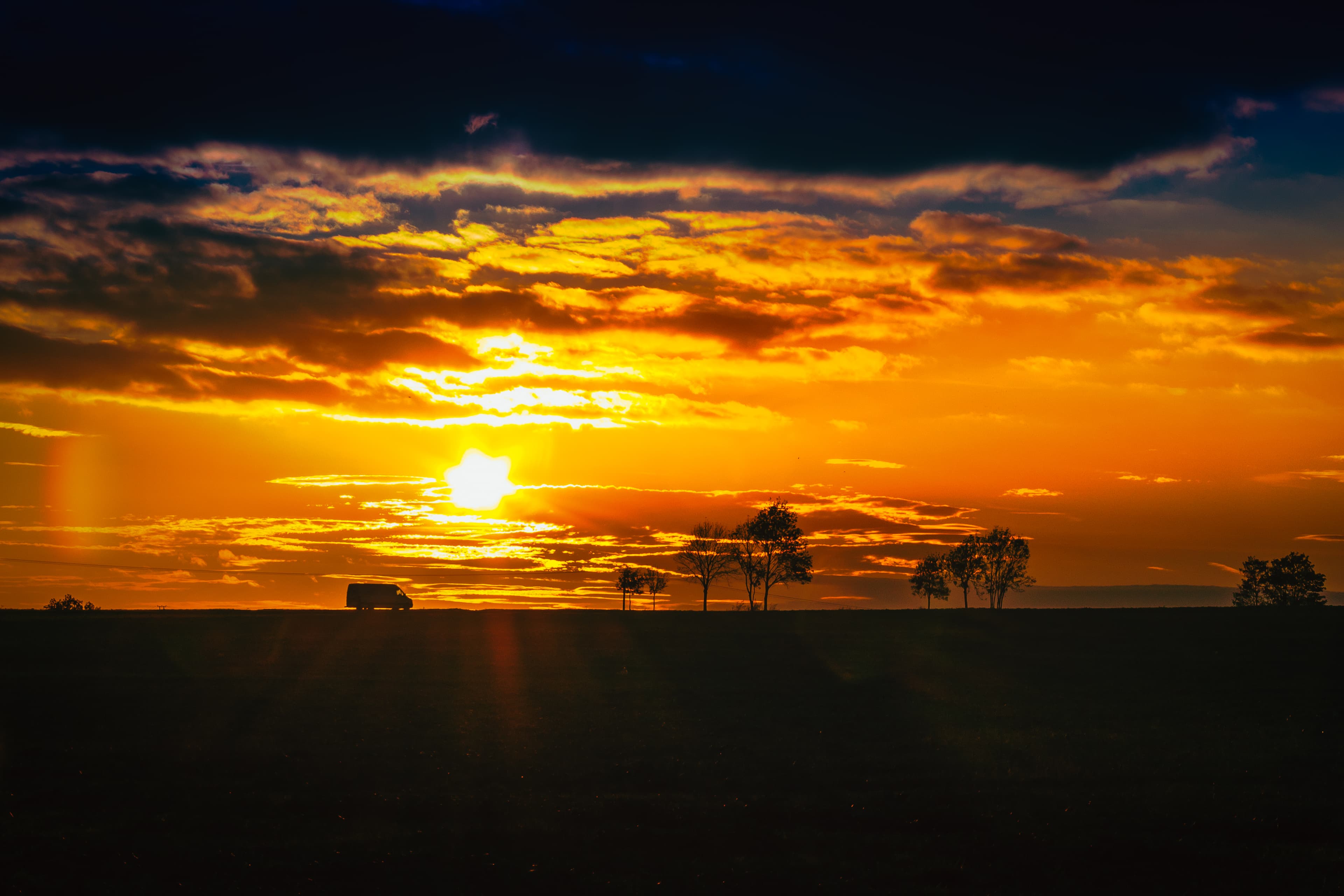 Evening sun over Cambourne fields, the light lasting just long enough for one frame.