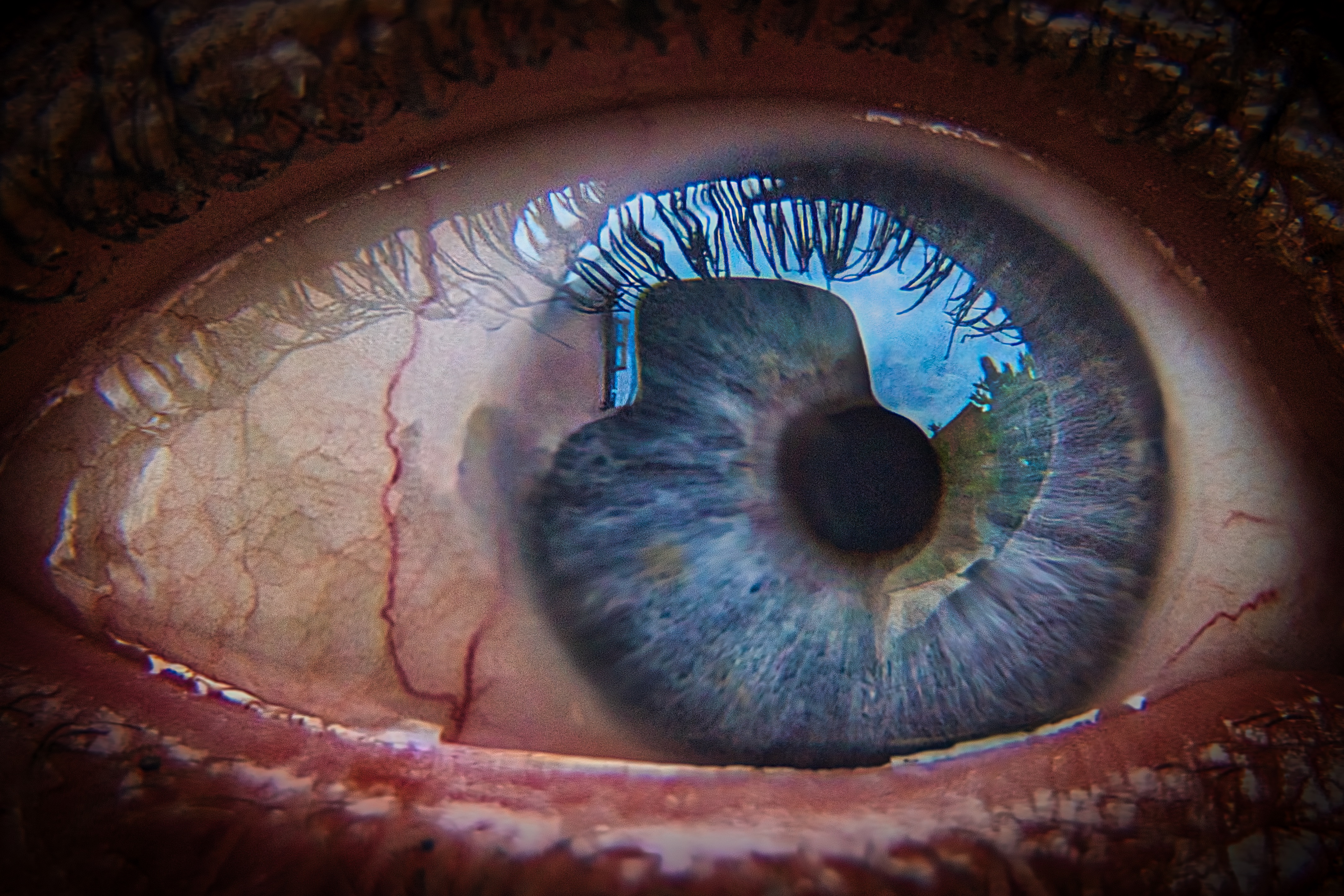 This stunning fine-art photograph captures the profound depth and intricate details of a human eye, evoking a soul's innermost essence. The interplay of light and shadow, combined with the rich, textured iris, creates a illusion of a viewer being gazing into the depths of another's soul. The composition, with its close-up perspective, invites the viewer to explore the mysteries of the human condition. This vibrant blue hue and the subtle reflections in eye's surface add a photograph a aesthetic appeal of a modern art gallery. Perfect for a living room focal piece, executive office, or modern gallery wall, this photograph is a perfect blend of art and emotion.