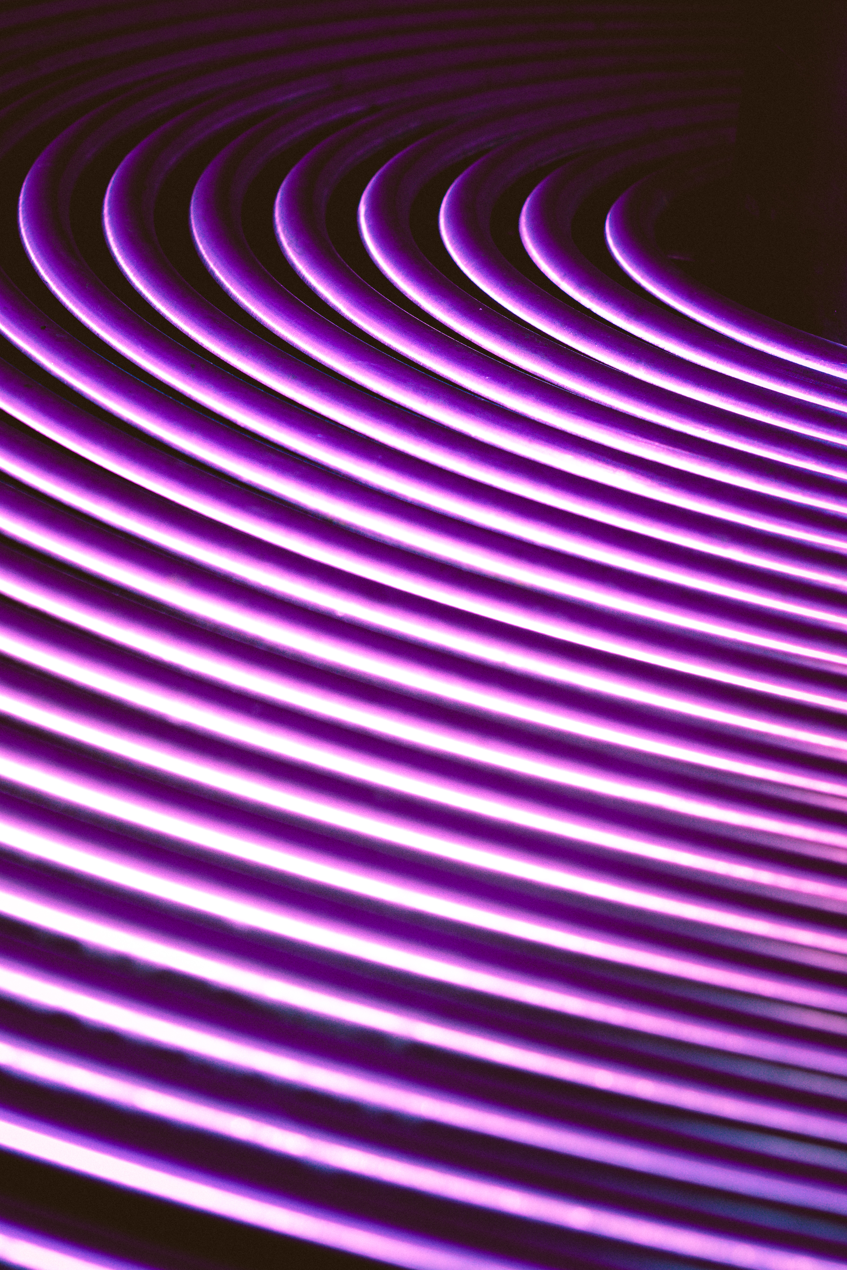This mesmerizing neon wave wall art captures the essence of modern, futuristic design with its dynamic, curved lines and radiant purple hues. The interplay of light and shadow creates a captivating visual effect, making it a perfect focal point for any contemporary living room or executive office. Its sleek, minimalist aesthetic complements a variety of interior styles, from industrial chic to modern minimalist, enhancing the ambiance with a energy of neon. Hang it as a centerpiece of a gallery wall or pair it with other geometric shapes to create a striking visual statement.