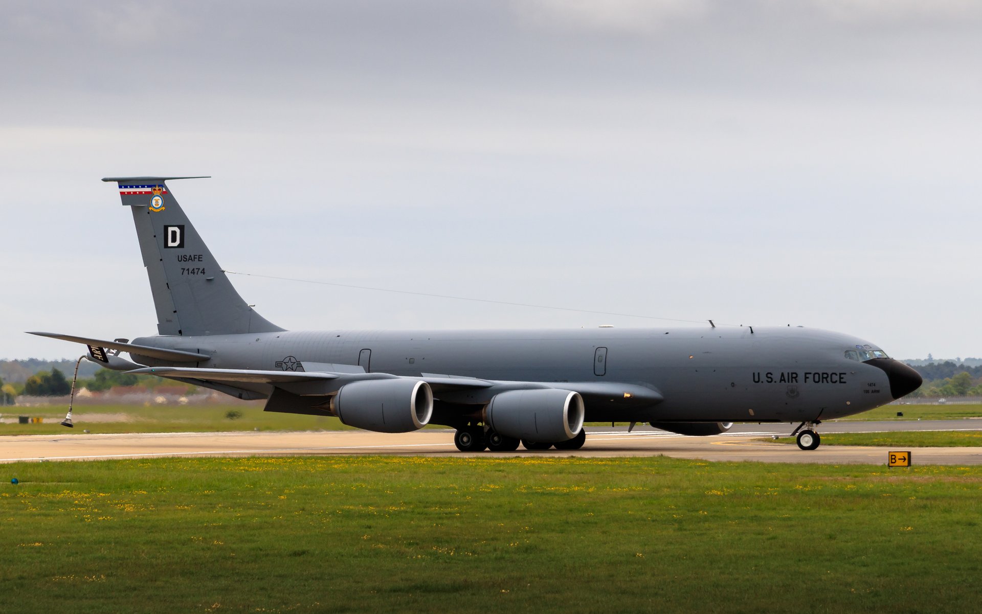 This photograph captures the timeless elegance of the U U.S. Air Force KC-135 Stratotanker, a iconic symbol of aviation prowess and military might. The image, bathed in natural light, exudes a serene yet powerful atmosphere of a aircraft on the runway, ready for its next mission. The composition, with the aircraft positioned centrally, draws the viewer's eye across the frame, creating a dynamic and engaging visual experience. Its sleek design and bold markings make it a perfect piece for any aviation enthusiast or military aficionado, serving as a focal point in a living room or a statement wall in the executive office. The image's aesthetic appeal lies in its ability to inspire a sense of adventure and respect for the military's role in our world.