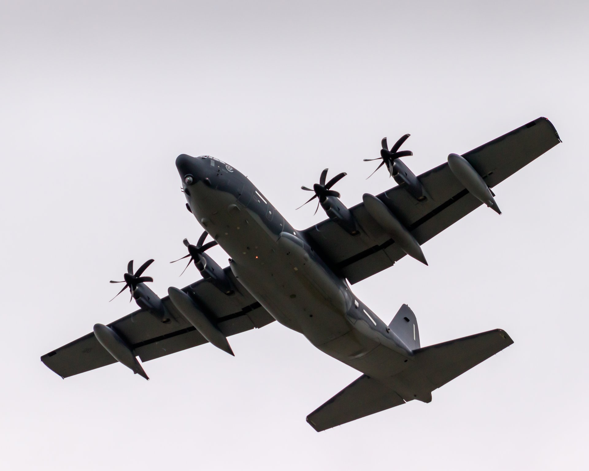 This striking photograph captures the C-130 Hercules in flight, showcasing its powerful presence against a sky. The image's dynamic composition and dramatic lighting evoke a sense of adventure and strength, making it a perfect centerpiece for any aviation enthusiast's collection. Its bold aesthetic appeal will complement a modern gallery wall or serve as a commanding focal point in an executive office, enhancing the space with a spirit of exploration and innovation.