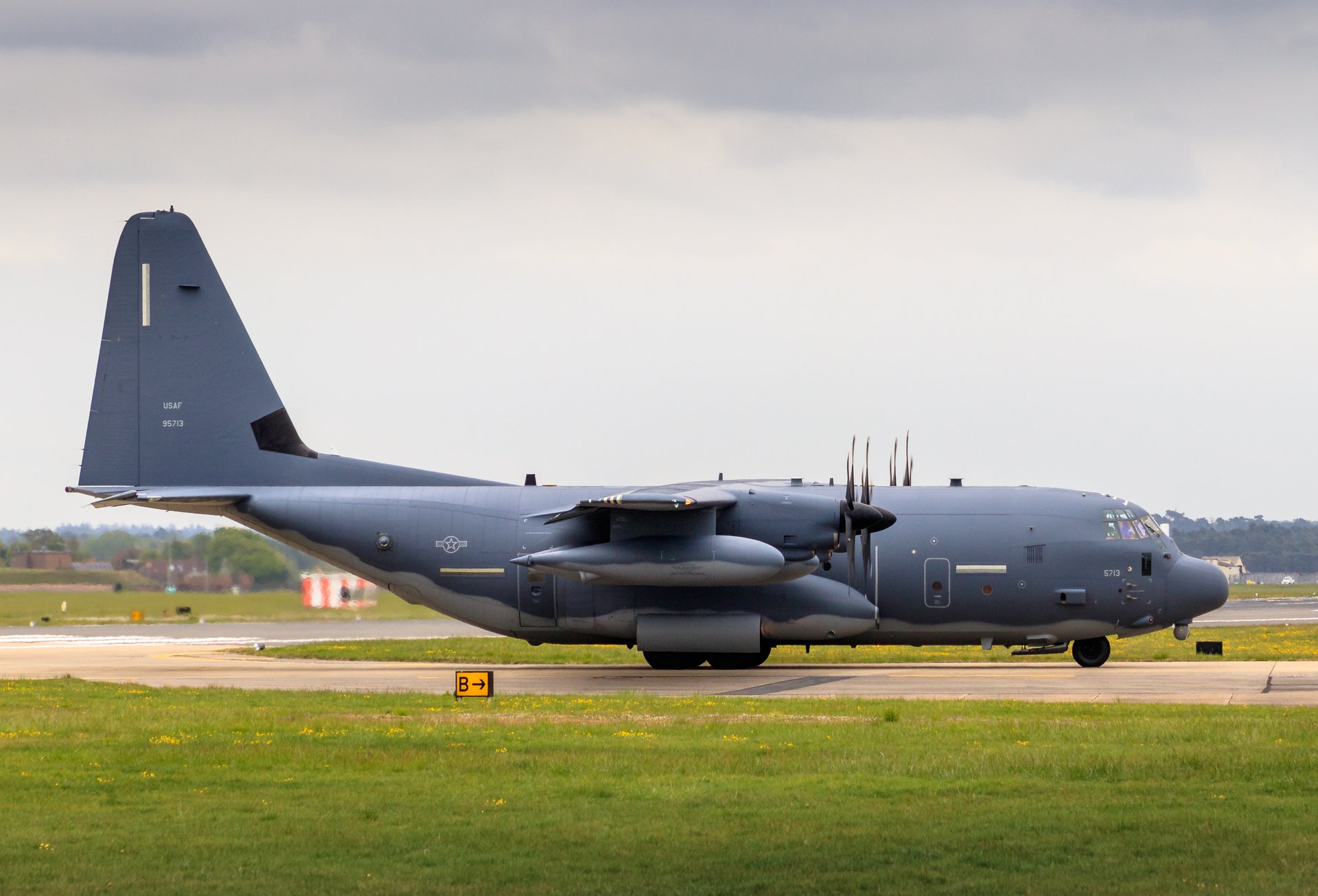 Capture the essence of aviation and military pride with this stunning fine-art print of a C-130 Hercules. The photograph, taken under a dramatic sky, beautifully highlights the aircraft's robust design and powerful presence. The composition, with the aircraft positioned centrally, draws the viewer's eye across the frame, creating a dynamic and engaging piece. The muted tones and soft lighting add a perfect touch of nostalgia and sophistication, making it a perfect focal point for any living room or a executive office. Display this print to inspire admiration for the military and aviation history, or to simply add a perfect touch of modern elegance to any space.