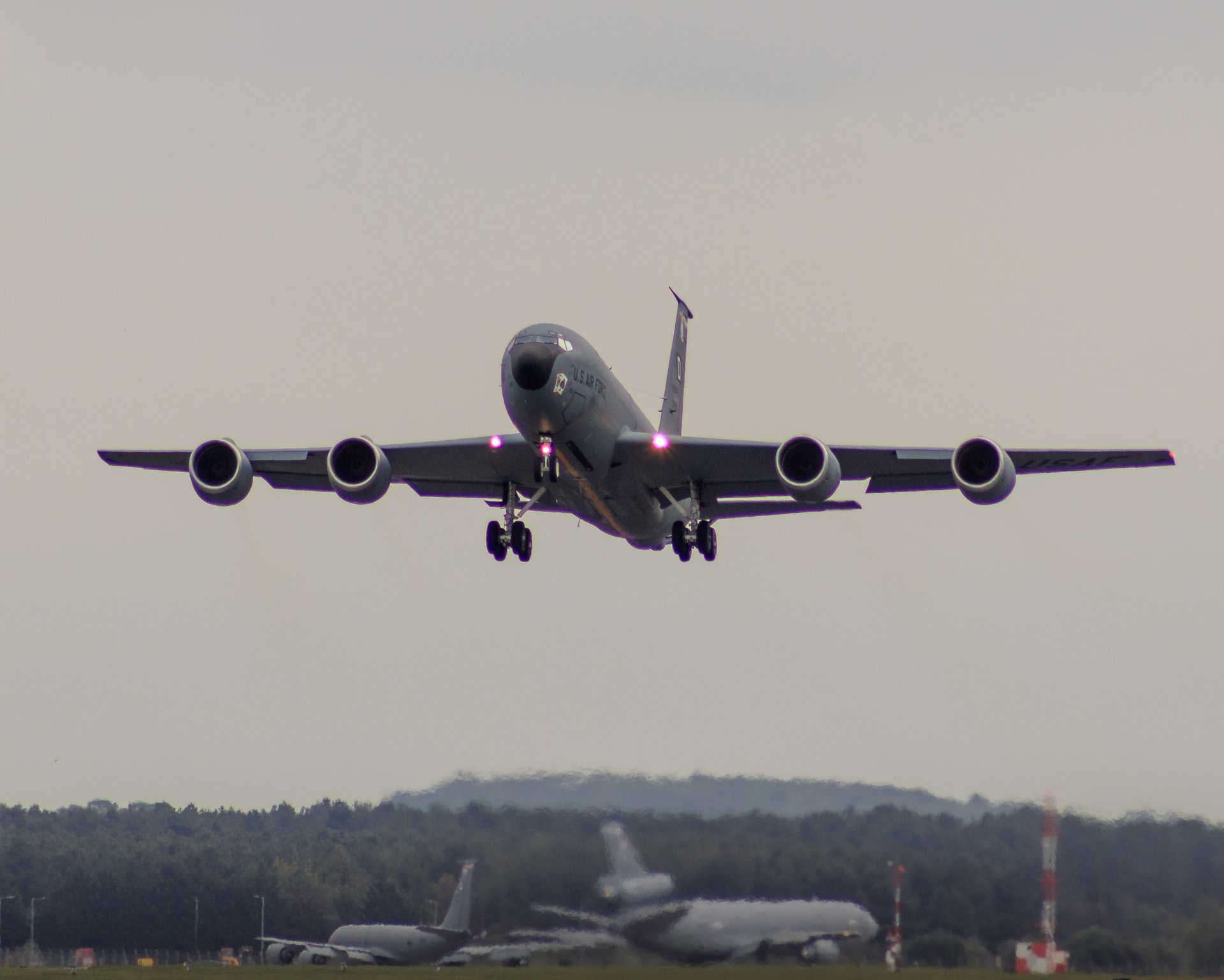 Capture the essence of aviation and the thrill of flight with this stunning photograph of a aircraft in moment of landing. The image, bathed in the soft, diffused light of an overcast sky, evokes a feeling of anticipation and the grandeur of travel. The composition, with the aircraft centered and the horizon subtly blurred, draws the viewer's eye into the scene, creating a perfect balance of motion and stillness. This rich, deep tones of the aircraft contrast beautifully with the muted colors of the sky, making it a perfect piece for any executive office or a modern gallery wall. Hang it in your living room to inspire a dreamer in you, or in office to remind you of the boundless possibilities of the sky.