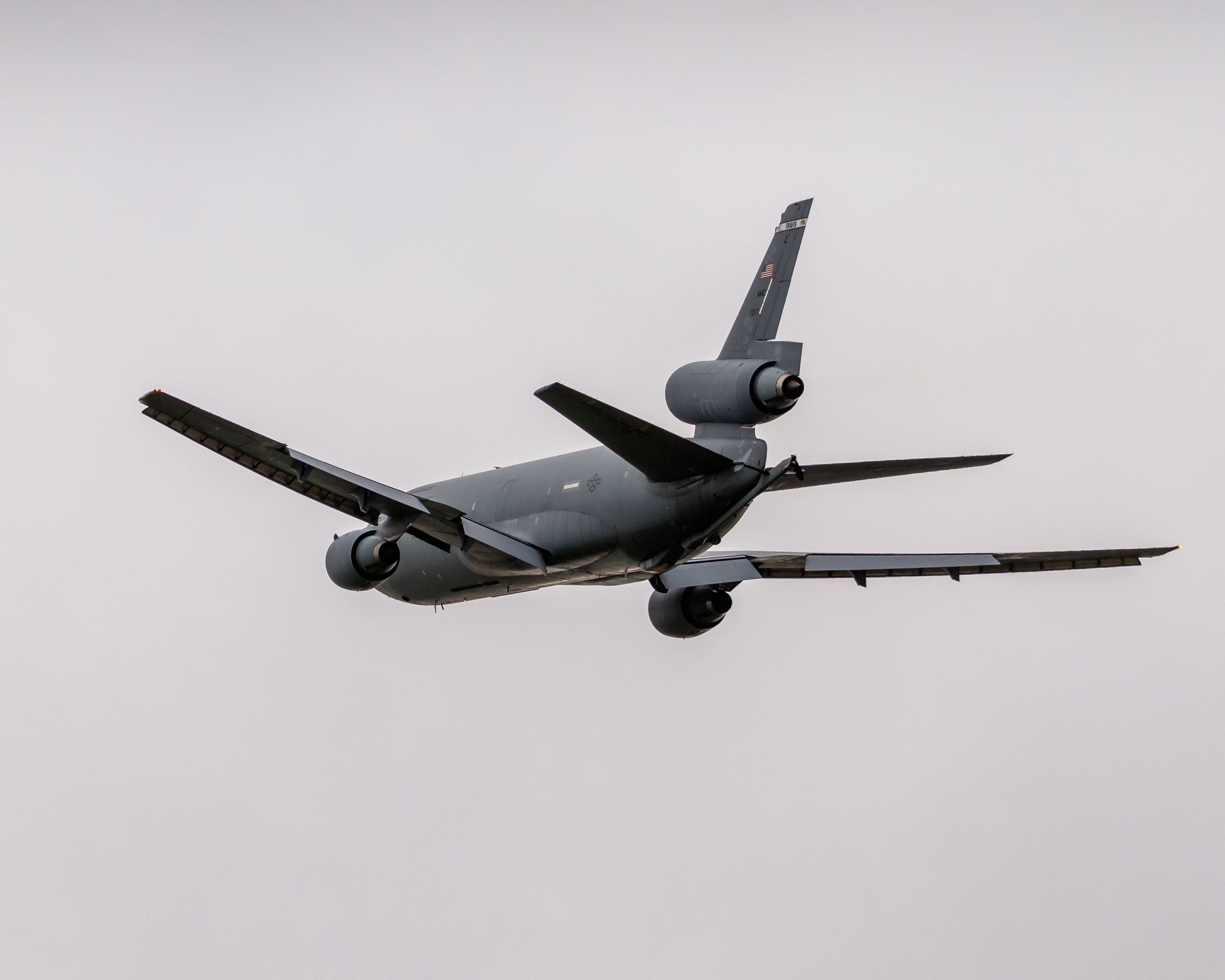 Capture the essence of aviation's grandeur with this stunning photograph of a L-1011 in sky. The image exudes a sense of freedom and adventure, with the aircraft gracefully soaring against a soft, diffused light of a overcast sky. The composition, with the aircraft positioned slightly off-center, adds a dynamic element that draws the viewer's eye across the frame. The muted tones of the aircraft contrast beautifully with the pale sky, creating a perfect balance of color and mood. This photograph is ideal for those who appreciate the beauty of engineering and the spirit of exploration, making it a perfect focal piece for a living room or an executive office, where it can inspire and motivate.