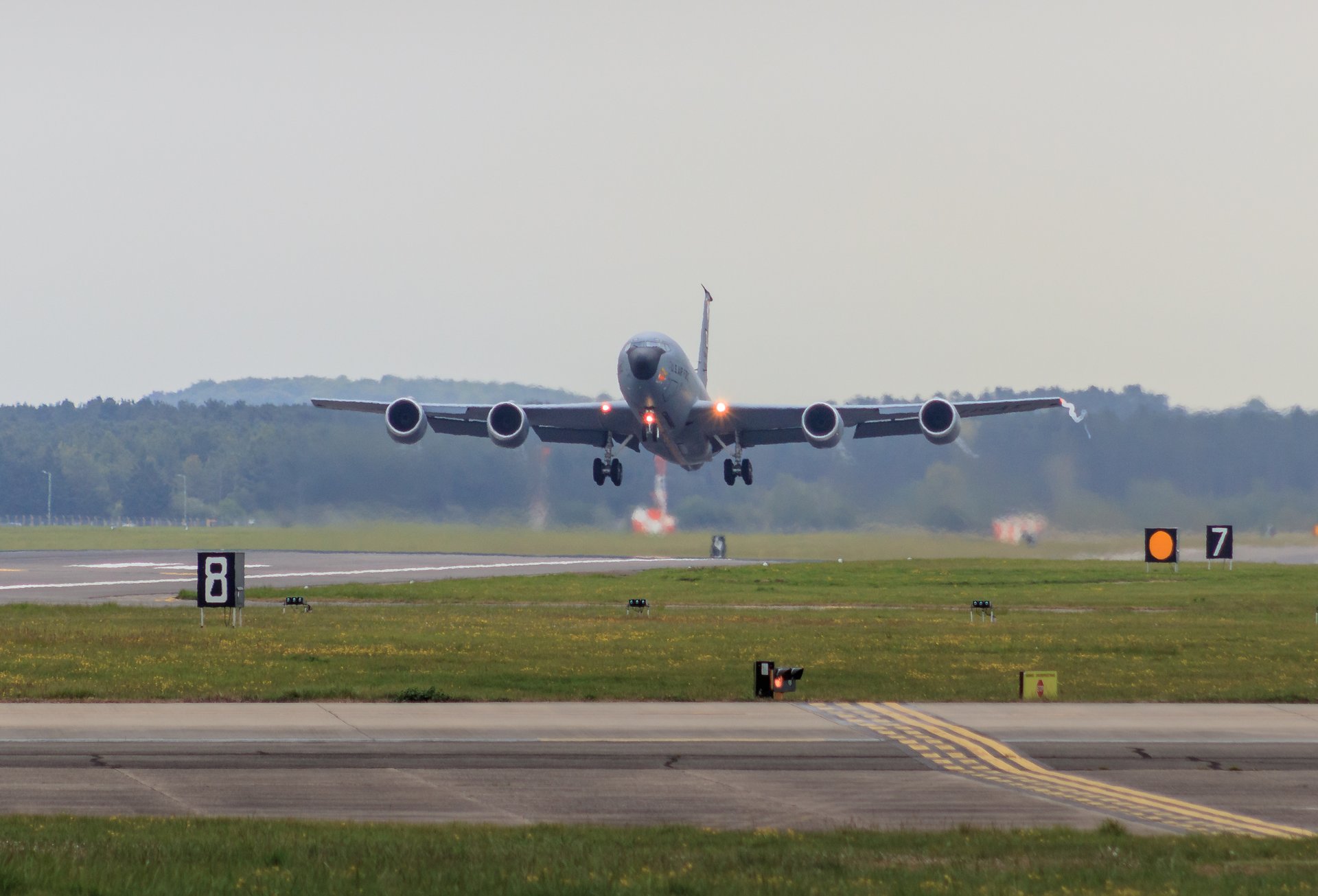 Capture the essence of aviation's grandeur with this photograph of a aircraft's graceful ascent. The soft, diffused light of the early morning or late afternoon bathes the scene in a perfect hue, evoking a calmness and anticipation of a journey. The composition, with the aircraft centered and the runway stretching into the horizon, creates a perfect balance of motion and stillness. This image's aesthetic appeal lies in its ability to inspire and transport viewers to the thrill of flight. Ideal for placement in a living room as a focal piece, or in executive office to symbolize the journey of success and innovation.
