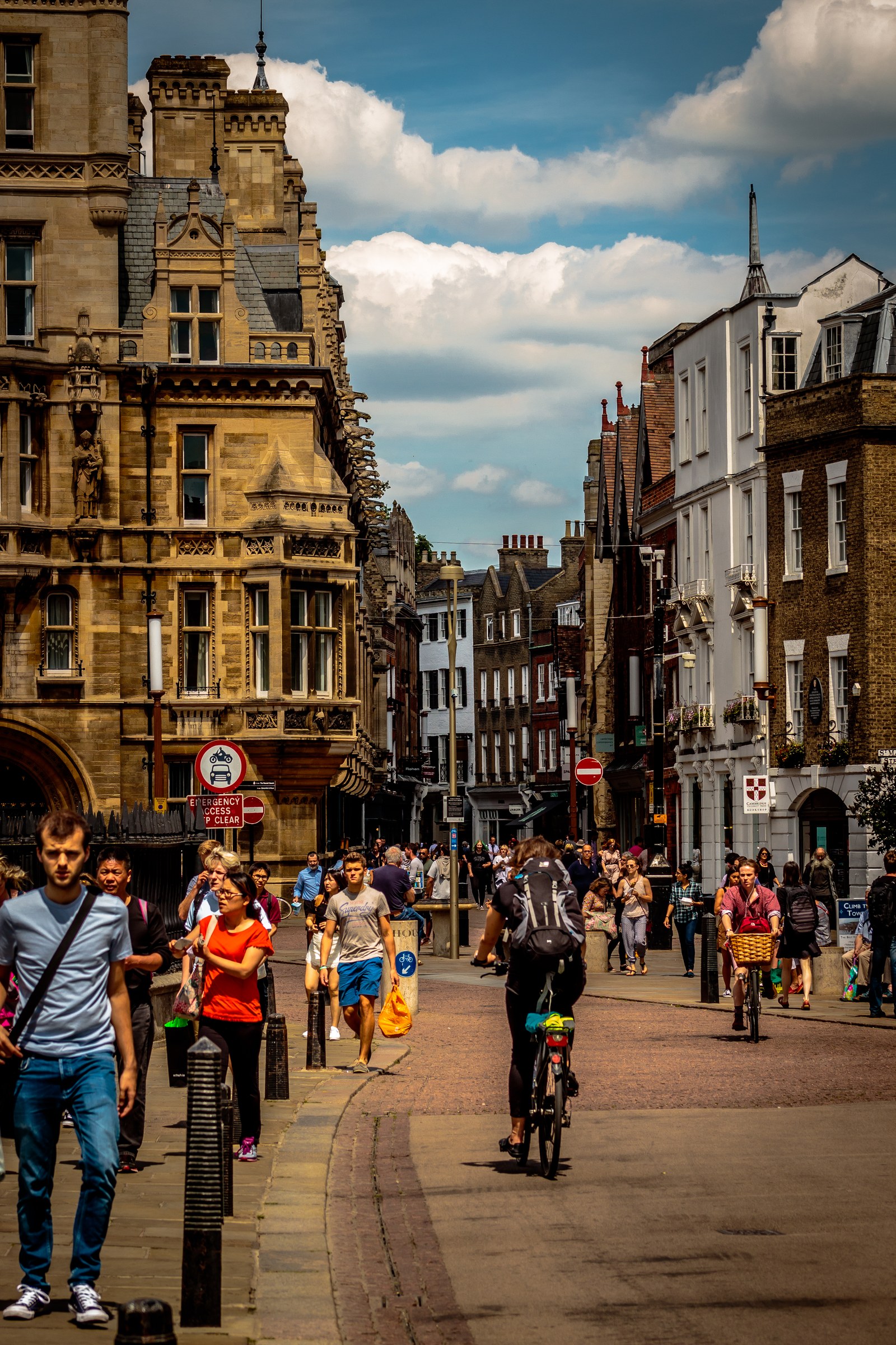 This photograph captures the vibrant energy of a city, where the interplay of light and shadow creates a dynamic and inviting atmosphere. The composition, with its bustling street life and historic architecture, evokes a charm of a urban landscape. The warm tones and soft lighting add a sense of calm and nostalgia, making it perfect for a living room as a a focal piece, or for an executive office to inspire creativity and a sense of community. The image's aesthetic appeal lies in its ability to transport viewers to a lively yet serene urban setting, making it a ideal choice for those who appreciate the beauty of everyday life.