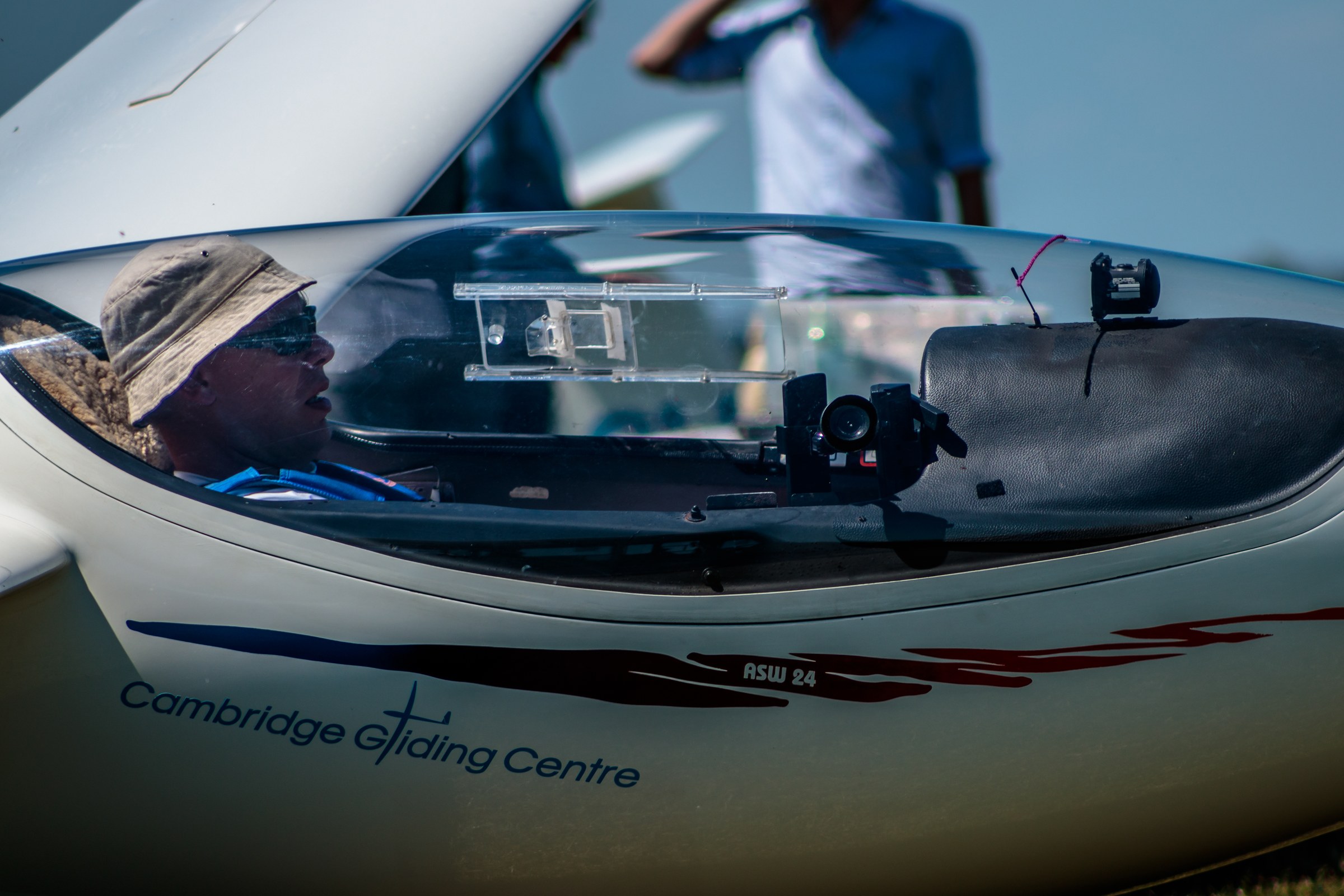 This captivating photograph, titled 'Elevate Your Space,' captures the serene essence of gliding, with a pilot in the cockpit of a sleek, modern glider. The image is bathed in natural light, highlighting the clean lines and vibrant colors of the aircraft, while the pilot's focused expression adds a perfect human element. The composition is balanced, with the pilot positioned in the foreground, drawing the viewer's eye into the scene. This aesthetic appeal lies in its simplicity and the sense of adventure it evokes. Perfect for a living room as a focal piece, or as a executive office's statement wall, this photograph is a perfect blend of art and inspiration.